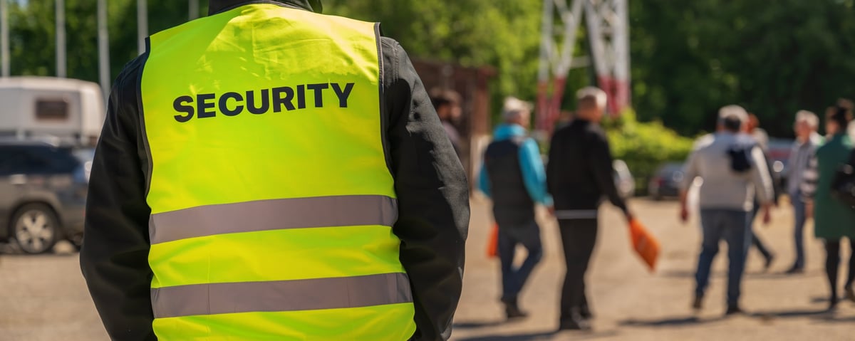 Security officer monitoring a crowd at a public event